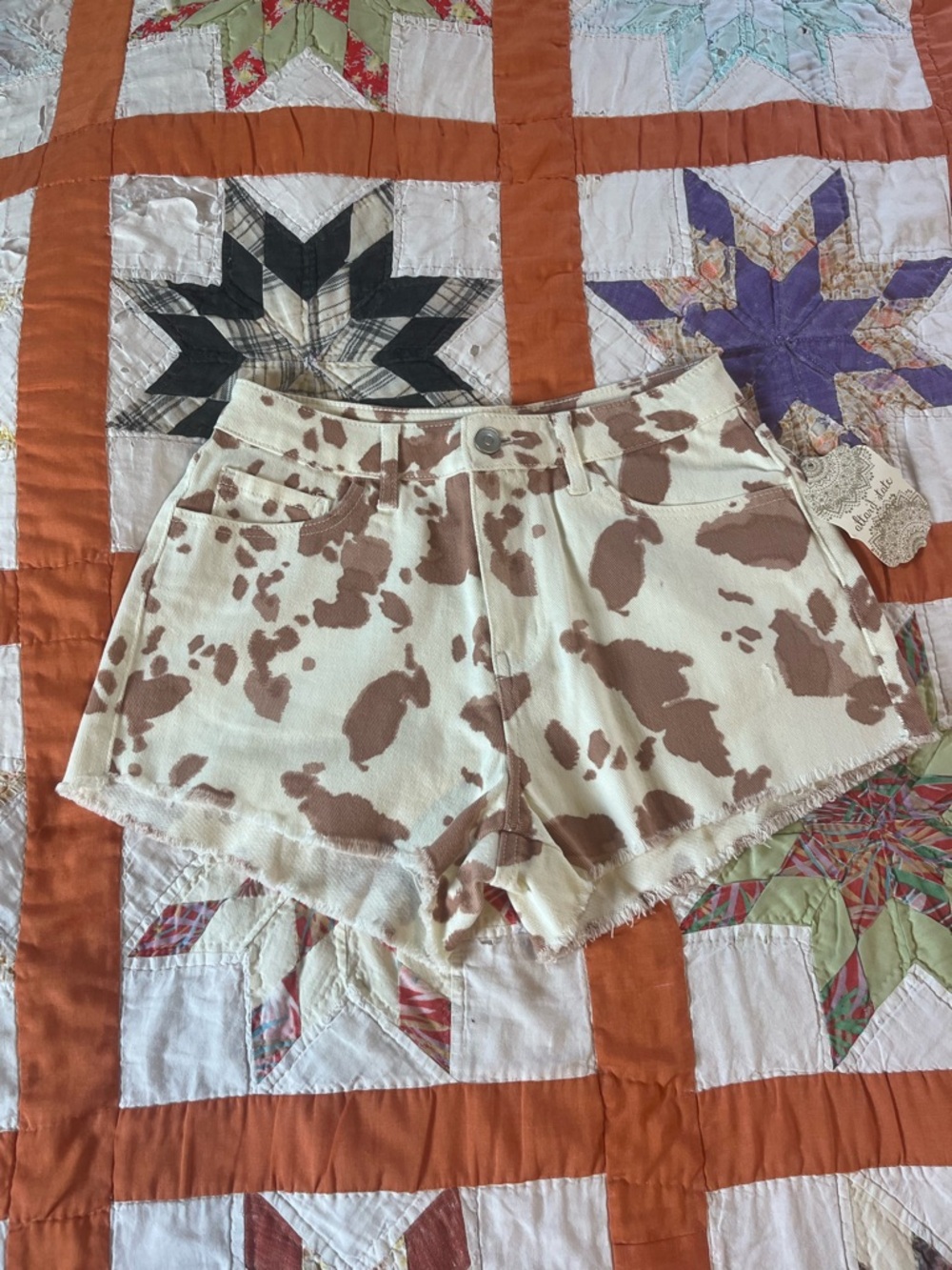 Altar'd State Cream and Brown Cow Print Denim Shorts